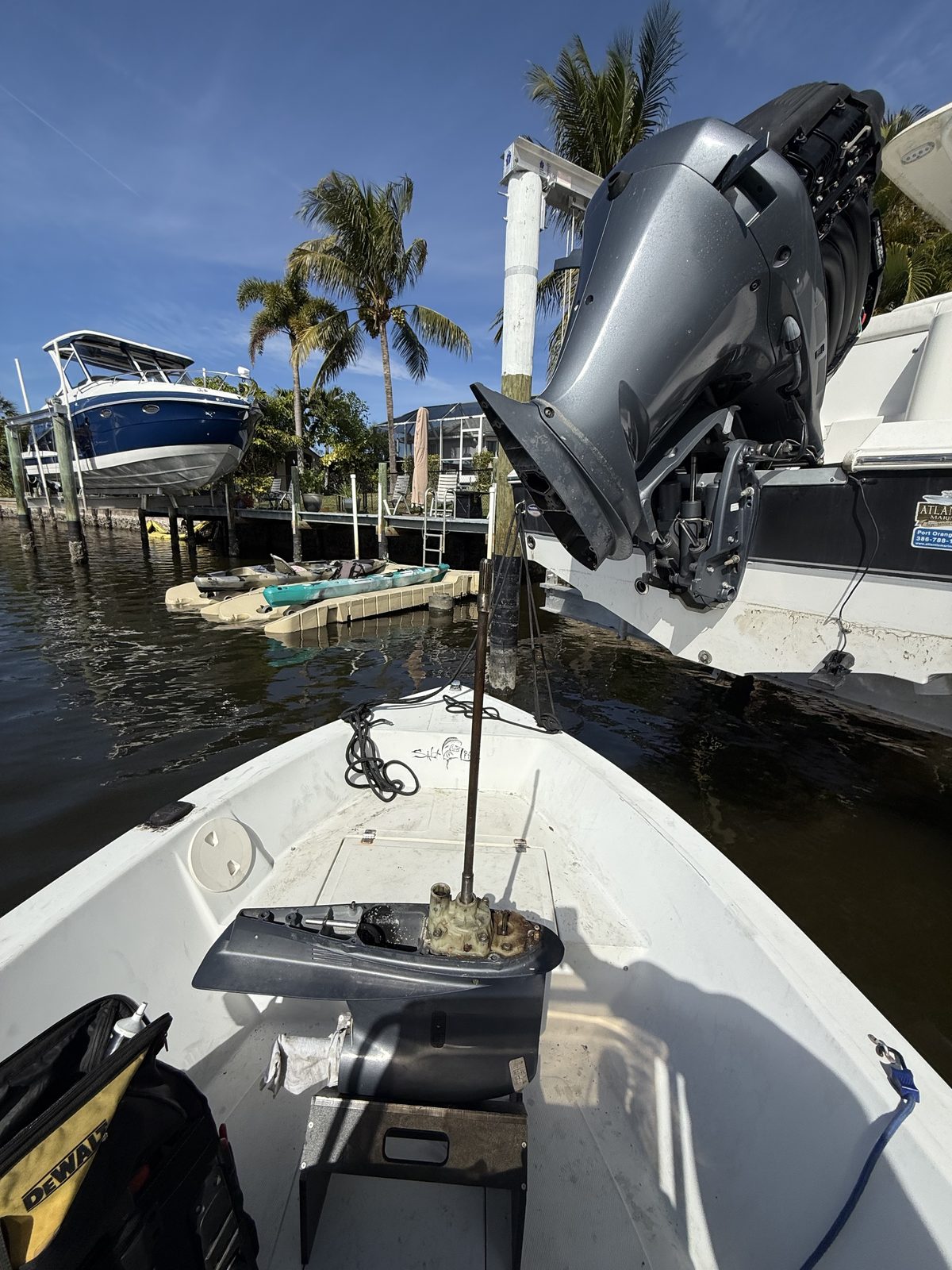 Outboard motor serviced dockside on a Southwest Florida canal
